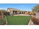 Spacious backyard with grassy area and patio at 20587 N 259Th Dr, Buckeye, AZ 85396