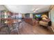 Casual dining area with a rustic wooden table and metal chairs near the kitchen at 20587 N 259Th Dr, Buckeye, AZ 85396