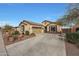 One-story house with attached garage and front patio at 20587 N 259Th Dr, Buckeye, AZ 85396