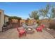 Relaxing backyard fire pit with seating for four at 20587 N 259Th Dr, Buckeye, AZ 85396