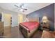 Spacious main bedroom with wood flooring and ceiling fan at 20587 N 259Th Dr, Buckeye, AZ 85396