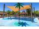 Community splash pad featuring palm tree water features, covered seating, and plenty of play areas at 20587 N 259Th Dr, Buckeye, AZ 85396