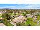 Expansive aerial view showcases an estate home with a pool and a lush green golf course at 21 E Oakwood Hills Dr, Chandler, AZ 85248