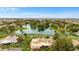 Drone shot showcasing the property's serene lakefront setting within a community of upscale residences at 21 E Oakwood Hills Dr, Chandler, AZ 85248