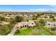 Aerial shot of a luxurious estate, highlighting its expansive grounds, mature trees, and lush landscaping in a neighborhood at 21 E Oakwood Hills Dr, Chandler, AZ 85248