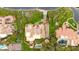 Overhead view of a luxurious home with a tile roof, landscaped grounds, a stream, and mature landscaping at 21 E Oakwood Hills Dr, Chandler, AZ 85248