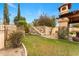 Picturesque backyard featuring steps, rock wall, desert landscaping and patio area at 21 E Oakwood Hills Dr, Chandler, AZ 85248