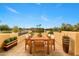 Balcony with wrought iron railing overlooking a lake and outdoor dining area at 21 E Oakwood Hills Dr, Chandler, AZ 85248