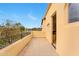 An outdoor balcony overlooking the yard with iron railings, views and an entry to the home at 21 E Oakwood Hills Dr, Chandler, AZ 85248