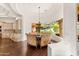 The dining area features hardwood floors, curved window, and chandelier lighting at 21 E Oakwood Hills Dr, Chandler, AZ 85248