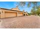 Spacious three-car garage with a brick driveway and well-manicured landscaping at 21 E Oakwood Hills Dr, Chandler, AZ 85248