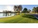 Scenic view of a tranquil lake with lush greenery, showcasing the community's natural beauty at 21 E Oakwood Hills Dr, Chandler, AZ 85248