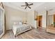 Cozy main bedroom features wood floors and neutral tones at 21 E Oakwood Hills Dr, Chandler, AZ 85248