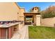 Outdoor kitchen featuring a sink, built-in grill, tile details, and nearby patio area at 21 E Oakwood Hills Dr, Chandler, AZ 85248