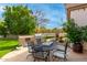 Landscaped backyard with a built-in grill and patio furniture at 21215 N 75Th St, Scottsdale, AZ 85255