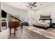 Main bedroom with a grand piano and large windows at 21215 N 75Th St, Scottsdale, AZ 85255