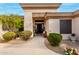 Inviting front entry with a modern door and well-maintained landscaping at 21215 N 75Th St, Scottsdale, AZ 85255