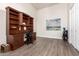 Home office with built-in desk and shelving at 21215 N 75Th St, Scottsdale, AZ 85255