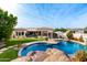 Inviting pool and spa with rock waterfall feature at 21215 N 75Th St, Scottsdale, AZ 85255