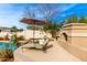 Poolside patio with lounge chairs and fire pit at 21215 N 75Th St, Scottsdale, AZ 85255