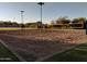 Outdoor sand volleyball court with nets and lights at 21215 N 75Th St, Scottsdale, AZ 85255