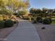 Curving concrete pathway through landscaped area at 21215 N 75Th St, Scottsdale, AZ 85255