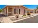 Tan single-wide manufactured home with carport and small front yard at 2400 E Baseline Ave # 84, Apache Junction, AZ 85119