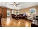 Living room with hardwood floors and leather furniture at 2400 E Baseline Ave # 84, Apache Junction, AZ 85119