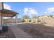 Backyard featuring low-maintenance landscaping, concrete patio, rock groundcover, and perimeter block wall at 26706 N 174Th Ln, Surprise, AZ 85387