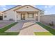 Covered patio with pavers and artificial grass, perfect for outdoor entertaining at 26706 N 174Th Ln, Surprise, AZ 85387