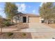 Charming single-story home with a two-car garage, desert landscaping, and a tile roof at 26706 N 174Th Ln, Surprise, AZ 85387