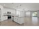 Modern kitchen features white cabinets, stainless steel appliances, and an island with granite countertops at 26706 N 174Th Ln, Surprise, AZ 85387