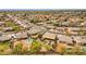 This aerial view highlights the putting green, covered patio, and neighborhood landscape at 3000 E Tulsa St, Gilbert, AZ 85295