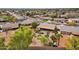 This aerial view reveals the putting green, hot tub, garden, and property landscaping at 3000 E Tulsa St, Gilbert, AZ 85295