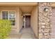 Close-up of the front entryway showing a storm door and decorative stonework at 3000 E Tulsa St, Gilbert, AZ 85295