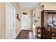 Inviting foyer featuring hardwood floors, a decorative cabinet, and neutral wall colors at 3000 E Tulsa St, Gilbert, AZ 85295