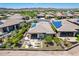 Expansive backyard with patio, fire pit, and lush desert landscaping in a vibrant community at 30343 N 130Th Dr, Peoria, AZ 85383