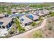 Aerial view of community featuring houses with solar panels at 30343 N 130Th Dr, Peoria, AZ 85383