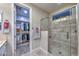 Bathroom featuring a tiled shower and walk in closet at 30343 N 130Th Dr, Peoria, AZ 85383