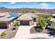 Beautiful single-story home with desert landscaping and a paver driveway in a vibrant community at 30343 N 130Th Dr, Peoria, AZ 85383