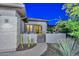 Inviting front entry with stone accents, desert landscaping, and a gated courtyard at 30343 N 130Th Dr, Peoria, AZ 85383