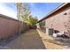 Long, narrow backyard with gravel and grass areas at 31689 N 128Th Dr, Peoria, AZ 85383