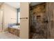 Large walk-in shower with built-in seat in this bathroom at 31689 N 128Th Dr, Peoria, AZ 85383