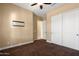 Bedroom with double doors and mounted TV at 31689 N 128Th Dr, Peoria, AZ 85383