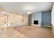 Living room with hardwood floors, fireplace, and neutral color scheme at 31689 N 128Th Dr, Peoria, AZ 85383