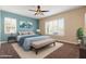 Serene bedroom featuring a ceiling fan, soft carpet, and cozy decor at 31689 N 128Th Dr, Peoria, AZ 85383