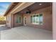 Covered patio with ceiling fan and windows at 31689 N 128Th Dr, Peoria, AZ 85383