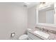 Small bathroom with granite countertop and white vanity at 3174 E Marlette Ave, Phoenix, AZ 85016