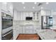 Modern kitchen with white shaker cabinets, granite countertops, and stainless steel appliances at 3174 E Marlette Ave, Phoenix, AZ 85016