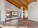 Bright living room featuring hardwood floors, high ceilings with wood beams, and access to a patio at 3174 E Marlette Ave, Phoenix, AZ 85016